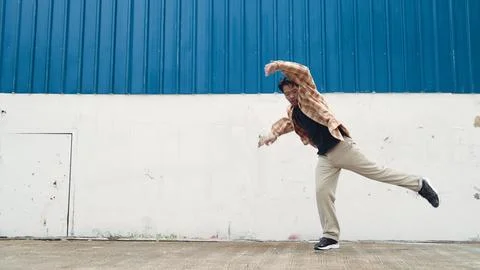 Hispanic funny choreographer dancing in hip hop style. Modern dance. Endeavor. Stock Photos