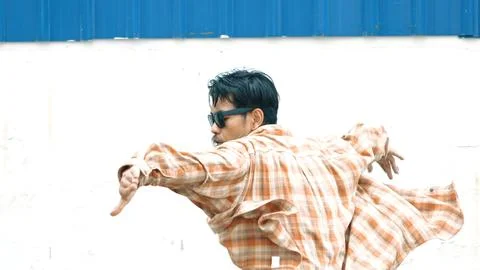 Hispanic funny choreographer dancing in hip hop style. Modern dance. Endeavor. Stock Photos