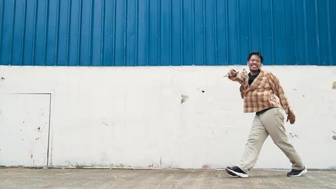 Hispanic funny choreographer dancing in hip hop style. Modern dance. Endeavor. Stock Photos