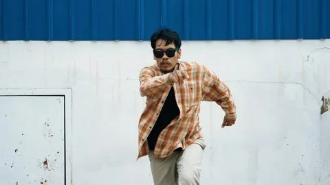 Hispanic funny choreographer dancing in hip hop style. Modern dance. Endeavor. Stock Photos