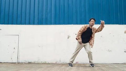 Hispanic funny choreographer dancing in hip hop style. Modern dance. Endeavor. Stock Photos
