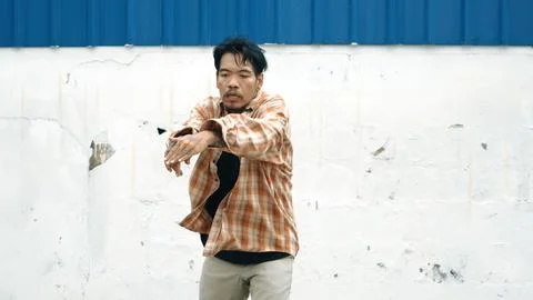 Hispanic funny choreographer dancing in hip hop style. Modern dance. Endeavor. Stock Photos