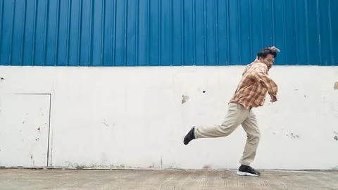 Hispanic funny choreographer dancing in hip hop style. Modern dance. Endeavor. Stock Photos