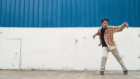 Hispanic funny choreographer dancing in hip hop style. Modern dance. Hiphop. Stock Photos
