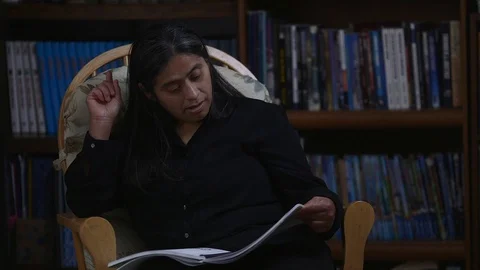 Hispanic Gets Hand Cramp From Turning Pages Stock Footage 110771671