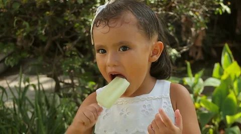 Hispanic Girl Eating Ice Pop Close Up (H... | Stock Video | Pond5