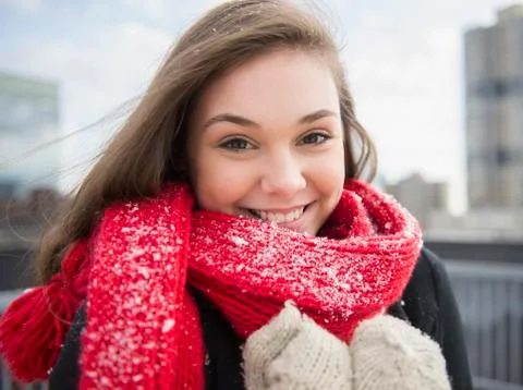 Hispanic girl wearing scarf in snow Stock Photos