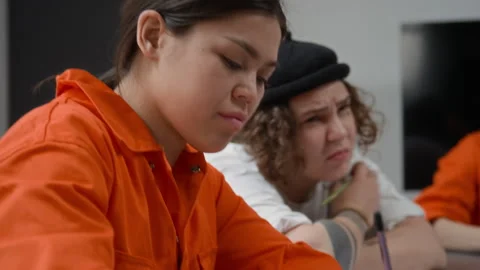 Hispanic Inmate in Class and Listening Intently at Prison Stock Footage 328987942