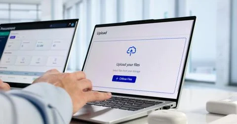 Hispanic IT Professional Uploads Secure Data To Encrypted Cloud Archive. 스톡 사진