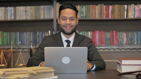 Hispanic Judge Smiling at Camera with Laptop Video stock 293260951
