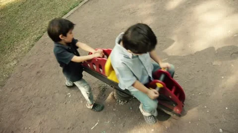 Hispanic Kids Playing in Public Playground Spring Horse Stock-Footage 20439285