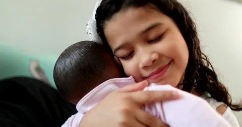 Hispanic little girl child hugging baby ... | Stock Video 