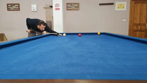 Hispanic man with beard playing French billiards Stock Footage 237267038