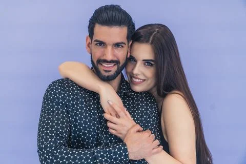 Hispanic man with beard wearing patterned shirt looking into camera his Stock Photos