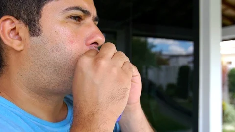Hispanic Man blowing up violet balloon in slow motion. Close up Shot Stock Footage 123242751
