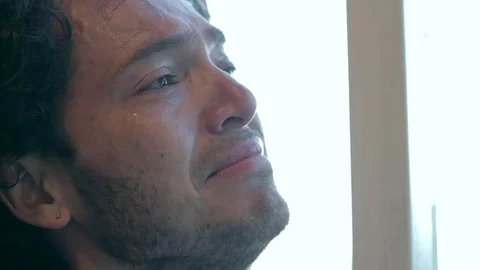 Hispanic man depressed drinking wine Stock Footage 79097670