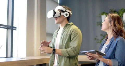 Hispanic man donning VR headset and navigating menus beside counter while Stock Footage 317640351