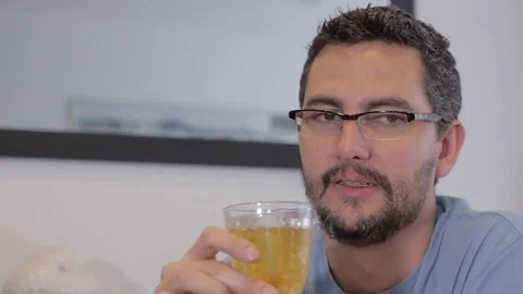 Hispanic man drinking wine and talking Stock Footage 79097688