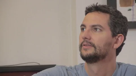 Hispanic man drinking wine having a conversation Stock Footage 79097638