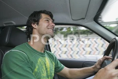 Hispanic man driving car Stock Photos