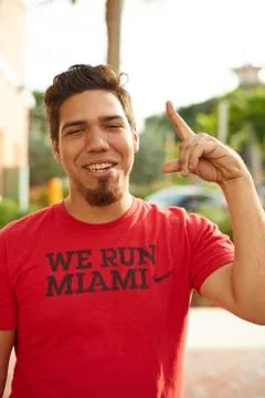 Hispanic man makes a hand gesture at the camera Stock Photos