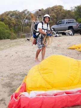Hispanic man paragliding Stock Photos