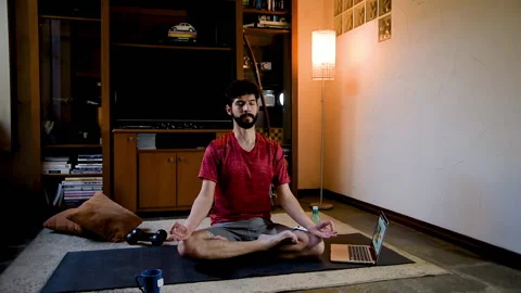 Hispanic man performing yoga practice online. Practice yoga Stock Footage 130608580