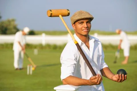 Hispanic man playing croquet Stock Photos
