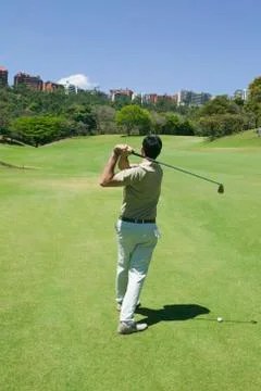 Hispanic man playing golf Stock Photos