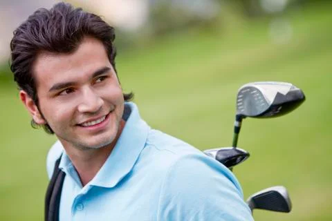 Hispanic man playing golf Photos