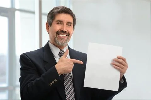 Hispanic Man Pointing to Empty Sign Stock Photos