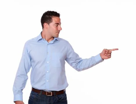 Hispanic man pointing to his left Stock Photos