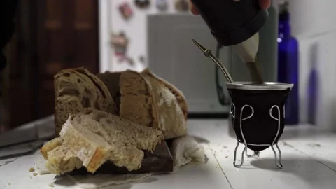 Hispanic man prepares an Argentinian drink - mate Stock Footage 201761051