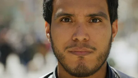 Hispanic man serious angry face portrait close up slow motion Stock Footage 106343613