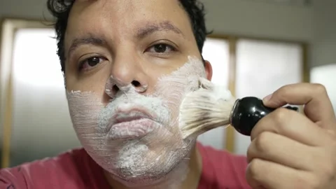 Hispanic man shaving in slow motion. 4k. Stock Footage 188225227
