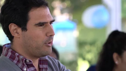 Hispanic Man Smiles During Conversation Happily Stock Footage 140170549