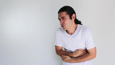 Hispanic man with stomach ache on a white background Stock-Footage 192491453