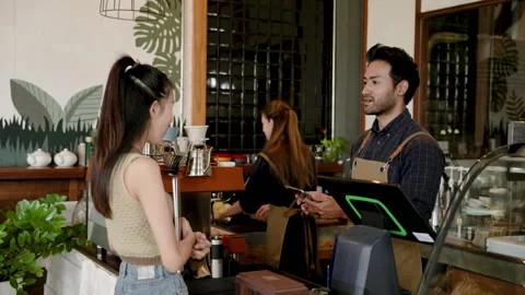 Hispanic man taking orders from beautiful Asian customers who regularly ord.. Stock Footage 247038413