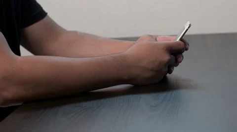 Hispanic Man Uses Smartphone Stock Footage 56347053