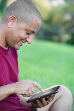 Hispanic man using tablet computer 스톡 사진