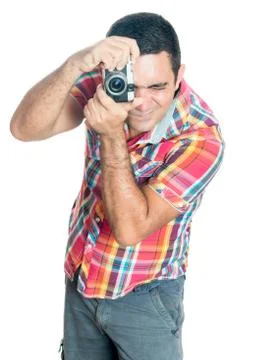 Hispanic man using a vintage looking compact camera Stock Photos