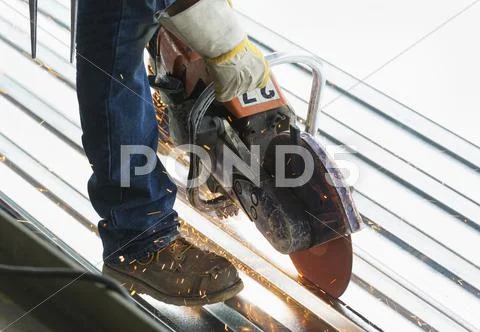 Hispanic man working at construction site Stock Photos
