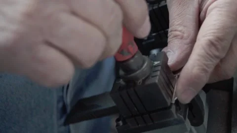 Hispanic man working on key duplication with special machinery. Manual Stock Footage 277019066
