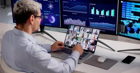 Hispanic Manager Hosting Virtual Webinar And Video Conference On Laptop At Ho Stock Photos