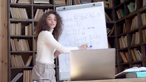 Hispanic math school teacher giving online class by computer zoom video call. Stock Footage 131112440