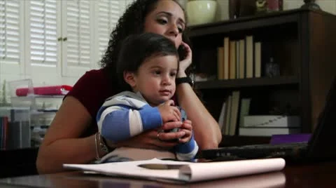 Hispanic mom on cell phone Stock Footage