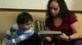 Hispanic mom with electronic tablet shows toddler HD Footage