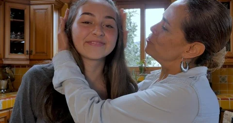 mom and daughter cam Hispanic Mother and teenage daughter kis... | Stock Video | Pond5