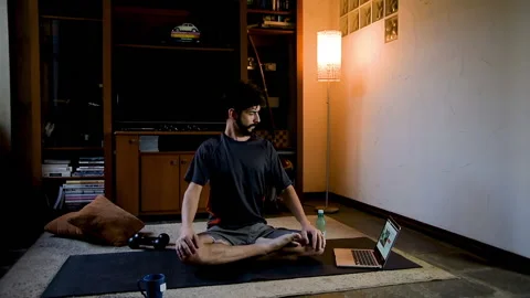 Hispanic performing meditation for yoga practice. Online classes concept Stock Footage 130616468