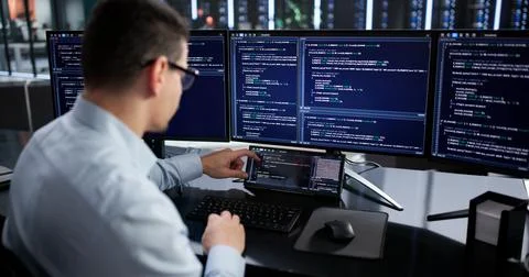 Hispanic Programmer Developing Software On Mini Computer For Data Analysis. 写真素材